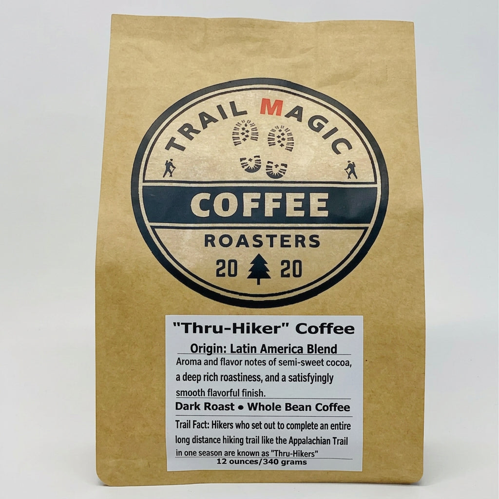 Kraft paper coffee bag with 'Trail Magic Coffee Roasters' branding on a white background
