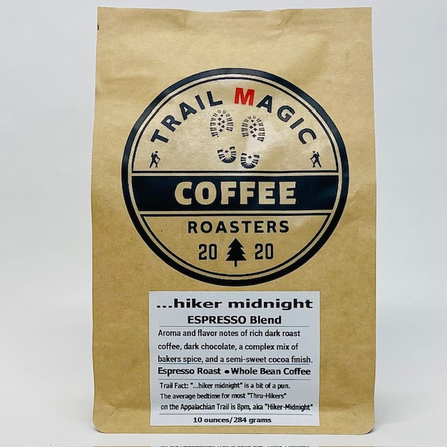 Kraft paper coffee bag with 'Trail Magic Coffee Roasters' logo on a white background