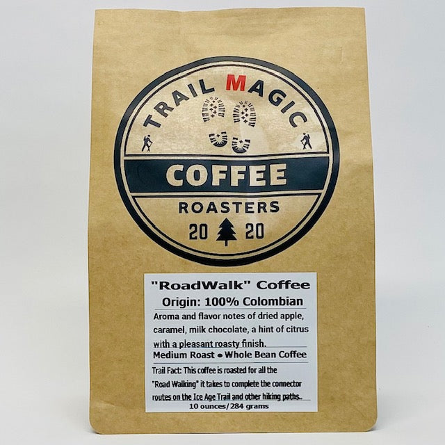 Kraft paper coffee bag with 'Trail Magic Coffee Roasters' logo and product details on a white background